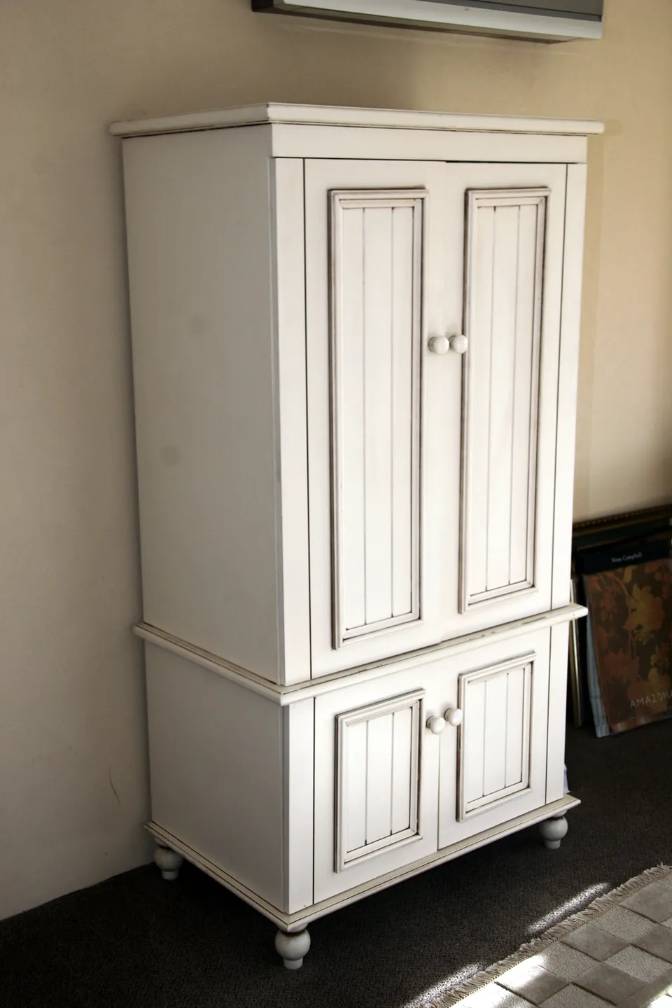 Painted armoire with raised-panel doors
