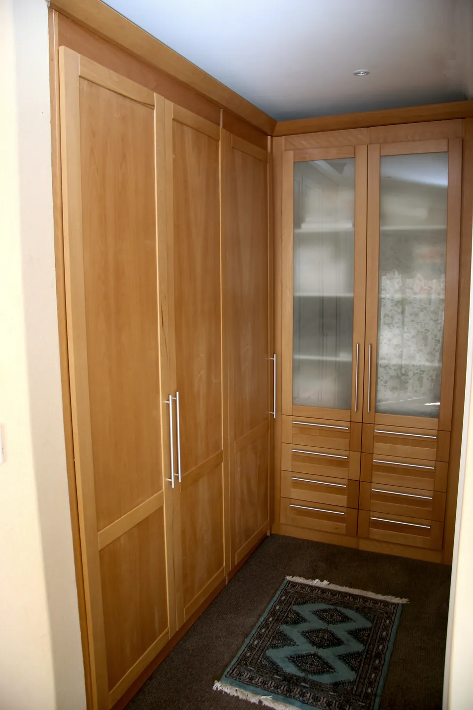 Wardrobes with a glazed linen cabinet