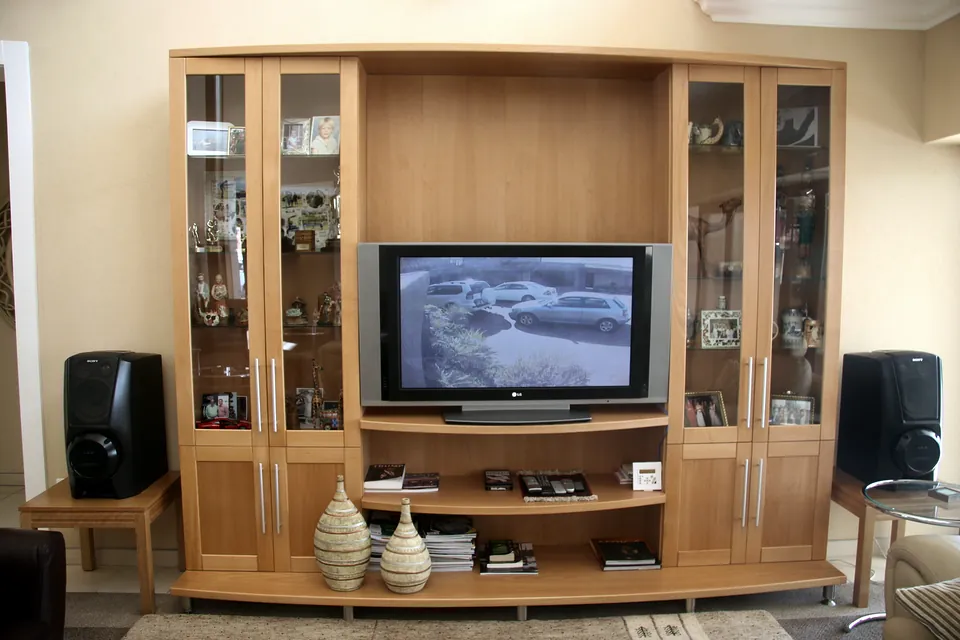 Media unit in pink beech with glazed display towers