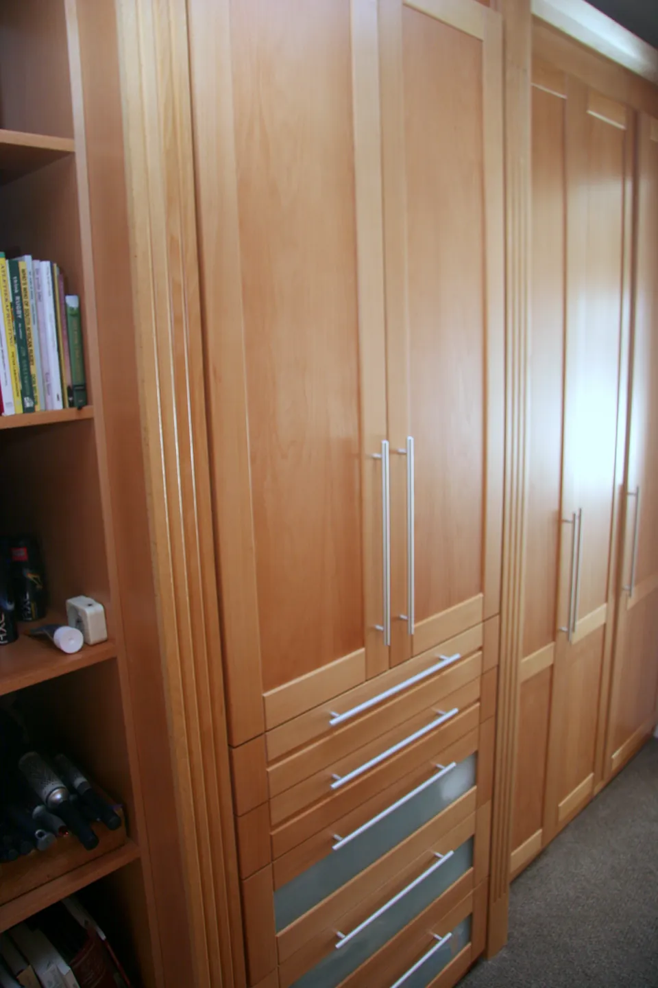 Wardrobe with a drawer bank and open shelving