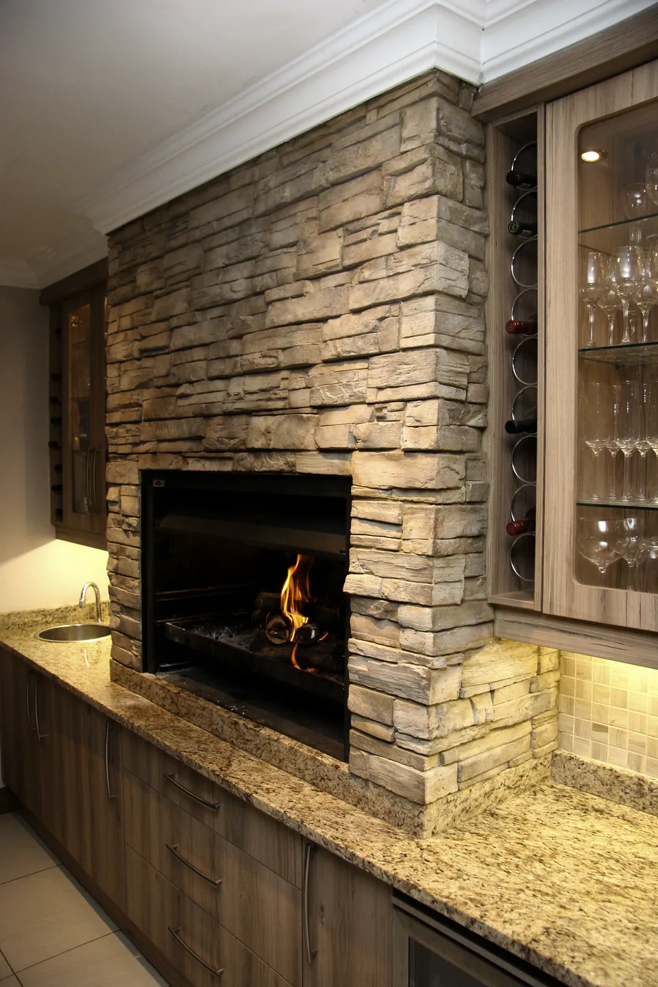 The fire seen past the stone chimney breast