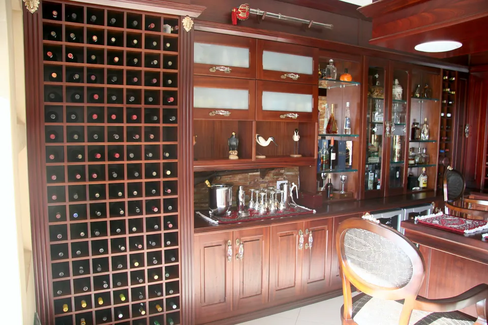 Wine wall and back bar with frosted-glass doors