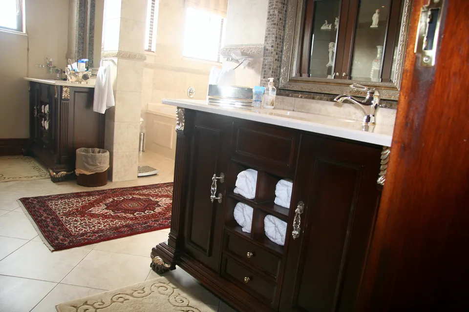 Main bathroom with a freestanding-style mahogany vanity