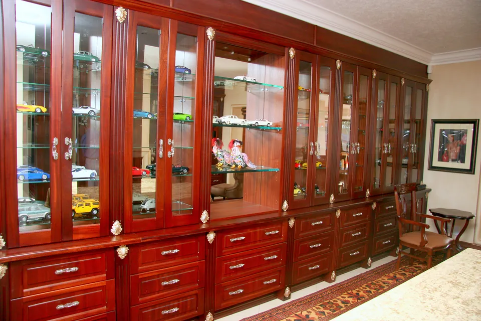 Billiard room lined with glazed mahogany display cabinets