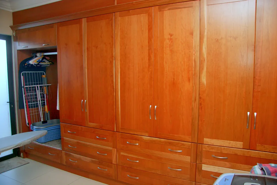 Laundry cupboards in semi-solid cherry