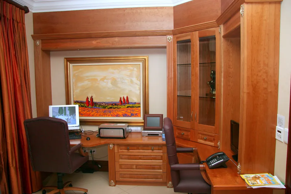 Study desk wall in solid cherry with glazed cabinets