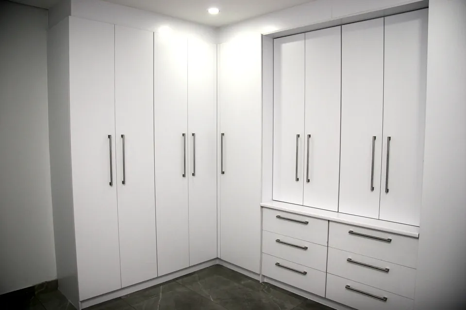 Full-height wardrobes with drawer banks