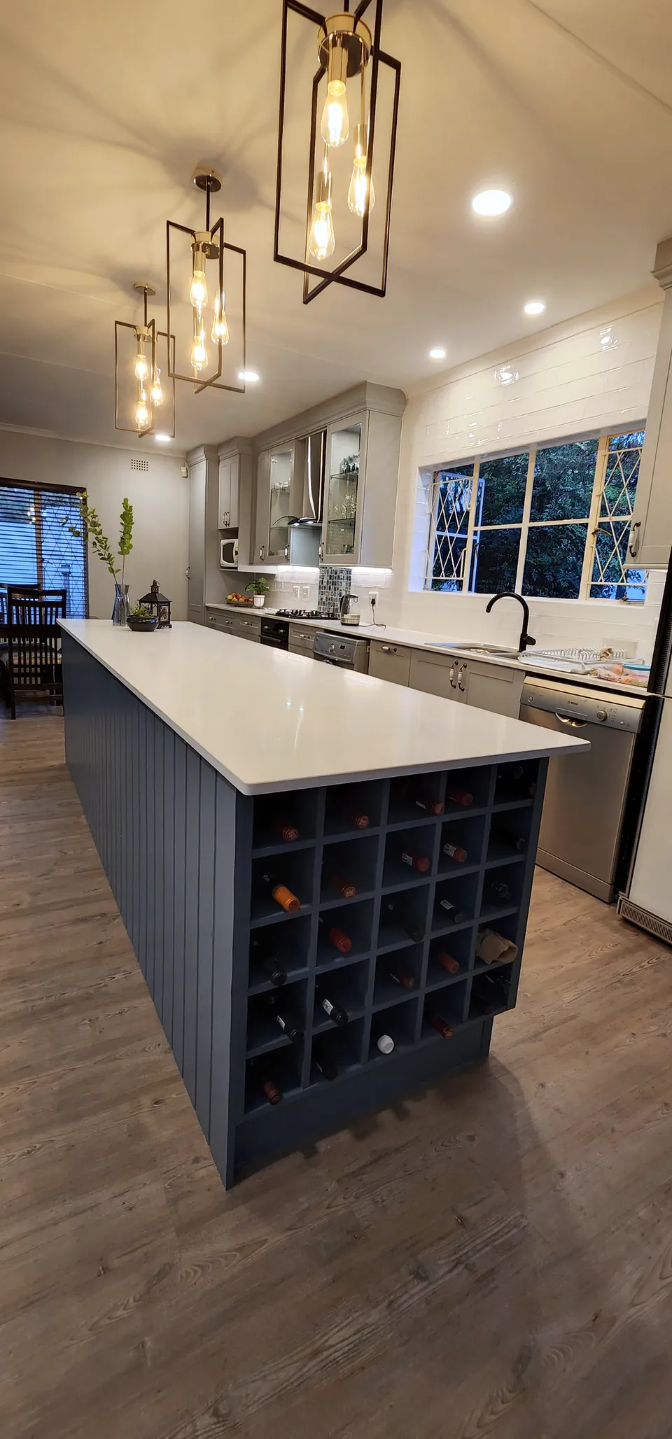 The island under a row of pendant lights