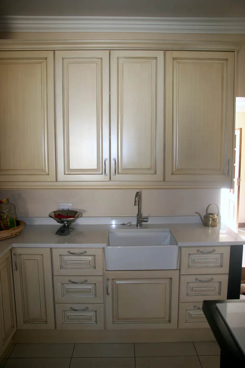 Sink run in cream with a ceramic sink